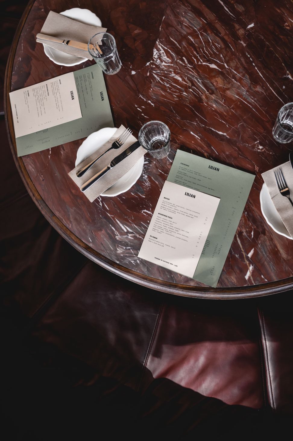 A marble table set for dinner, from above